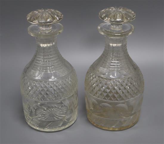 A pair of Georgian cut glass decanters and stoppers height 23cm